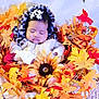baby, infant, sleeping, basket, autumn_leaves, sunflower, fall, cozy_clothing, headwear, white_jacket, indoor, decorative_leaves, cute, peaceful, portrait, child, nature_theme, seasonal, soft_lighting, resting