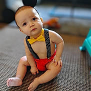Jeffery joined the competition — help win amazing prizes! baby, child, sitting, carpet, yellow_bow_tie, polka_dot_suspender, headband, black_ears, indoors, cute, curious, bare_chest, red_shorts, infant, floor, person, toddler, expression, playful, young_child