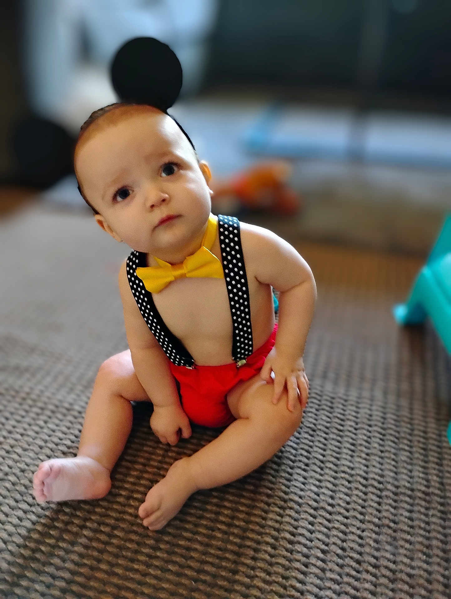 Jeffery joined the competition — help win amazing prizes! baby, child, sitting, carpet, yellow_bow_tie, polka_dot_suspender, headband, black_ears, indoors, cute, curious, bare_chest, red_shorts, infant, floor, person, toddler, expression, playful, young_child