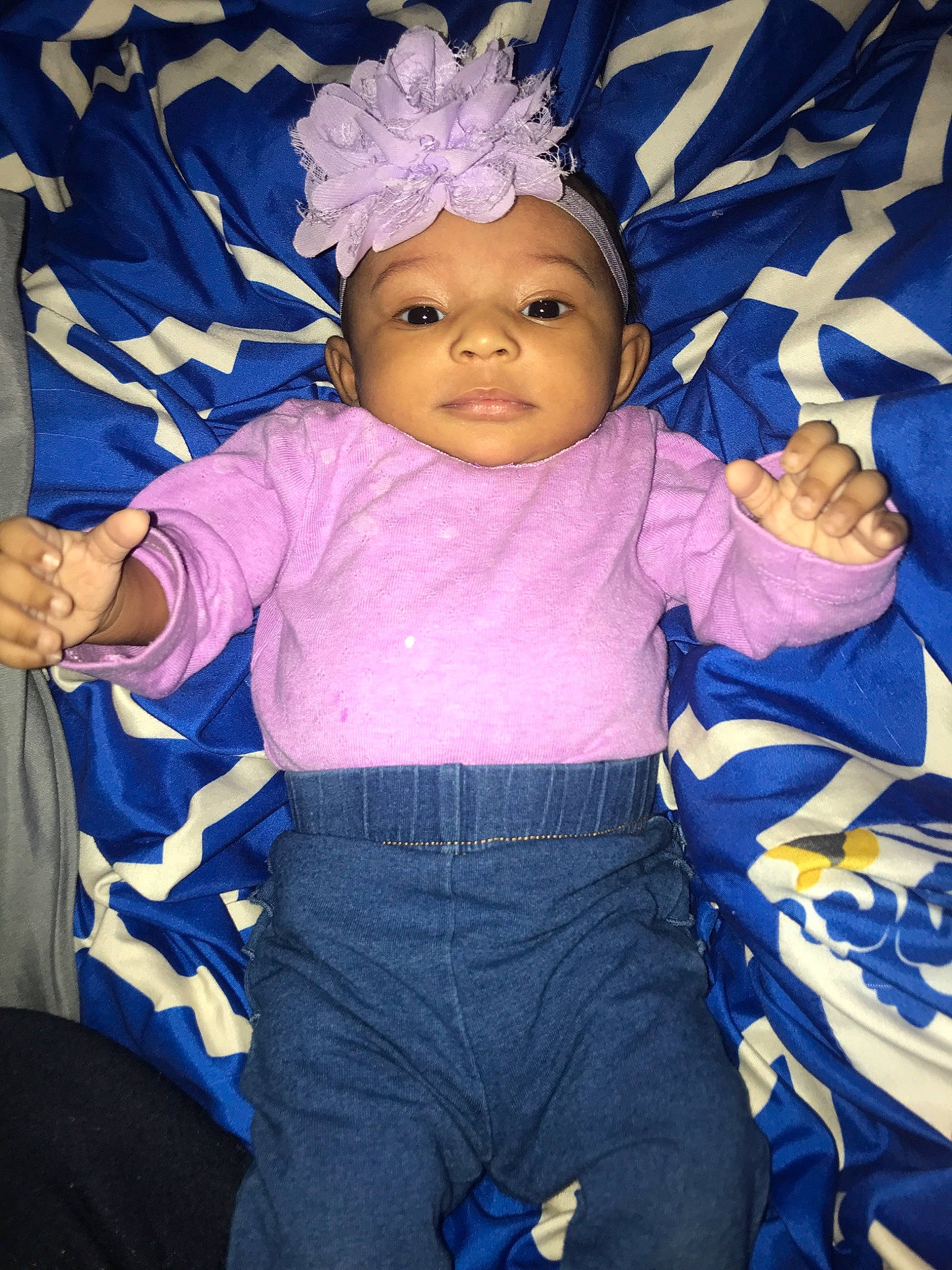 Amoura is registered to the contest to win money with this photo: baby, baby_products, blue, cheek, child, electric_blue, eye, face, hair_accessory, head, headgear, headwear, iris, person, pink, plant, product, purple, smile, textile