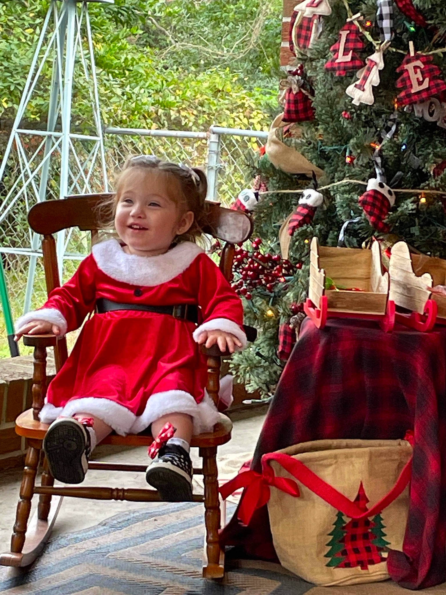 Brookelyn Rose is registered to the contest to win money with this photo: child, christmas, christmas_decoration, christmas_ornament, christmas_tree, event, fun, holiday, holiday_ornament, leisure, magenta, ornament, person, plant, recreation, red, sitting, smile, toddler, tree