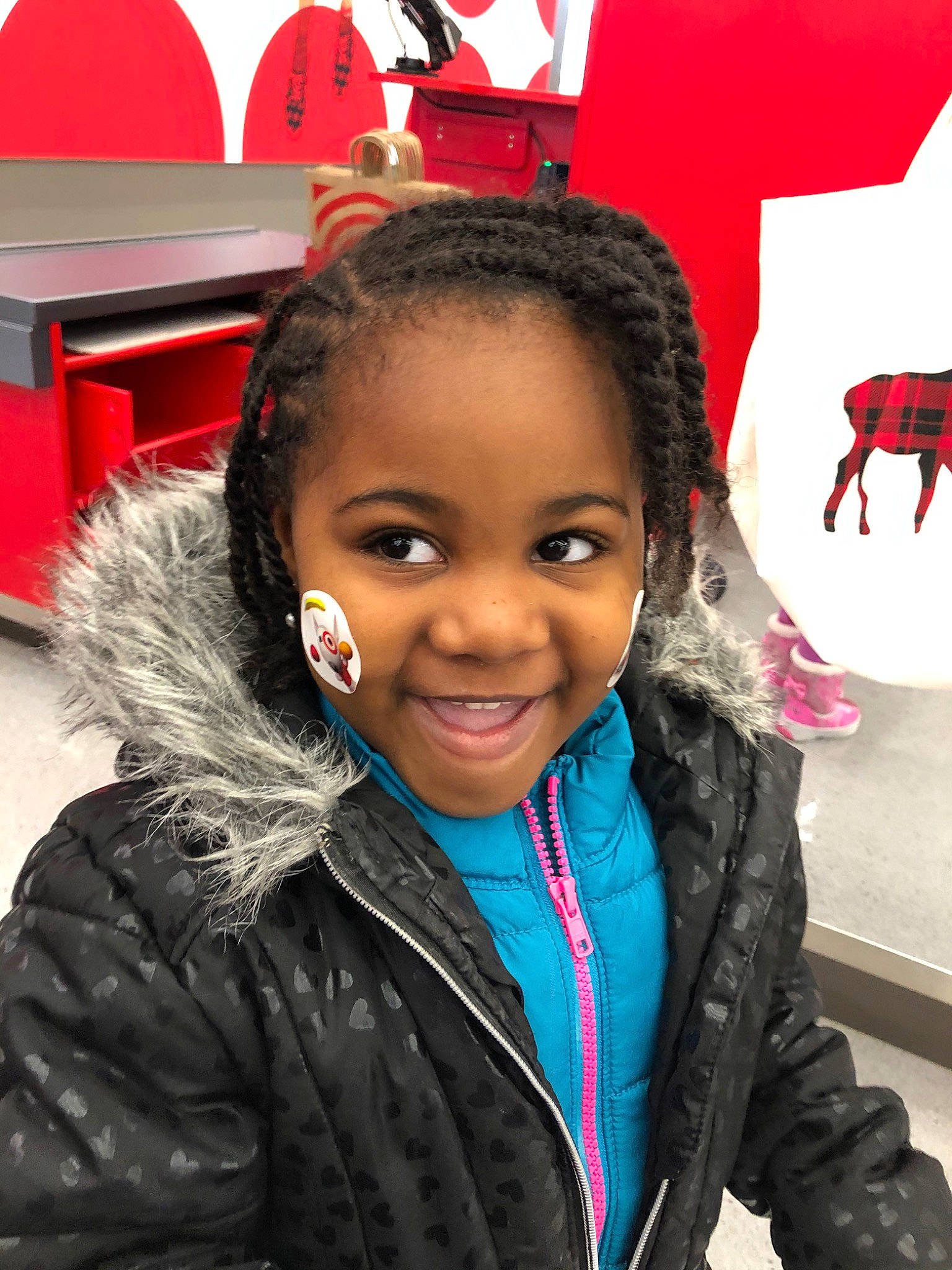 Zofia is registered to the contest to win money with this photo: black_hair, child, cornrows, forehead, hair, hairstyle, jacket, joy, long_hair, outerwear, person, smile