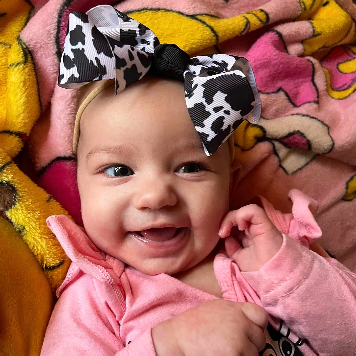 Vivian joined the competition — help win amazing prizes! apparel, baby, blanket, bow, cartoon_pattern, child, closeup, cozy, cute, face, fingers, hand, happy, headband, indoors, infant, pink_clothing, portrait, smiling, soft_toy