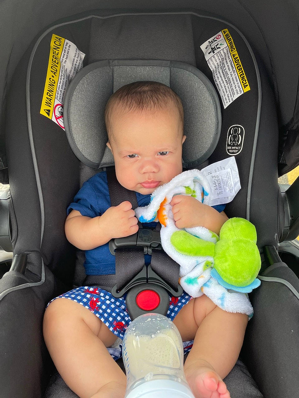 Karter is registered to the contest to win money with this photo: arm, baby, baby_toddler_clothing, car_seat, car_seat_cover, child, comfort, finger, green, lap, leg, light, motor_vehicle, people, person, product, skin, thigh, toddler, white