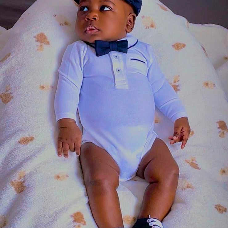 Momo participe au concours pour gagner de l'argent avec cette photo : baby, blanket, bow_tie, boy, cap, child, clothing, couch, cute, expression, fashion, footwear, indoor, infant, onesie, portrait, relaxing, shoes, sitting, young_child