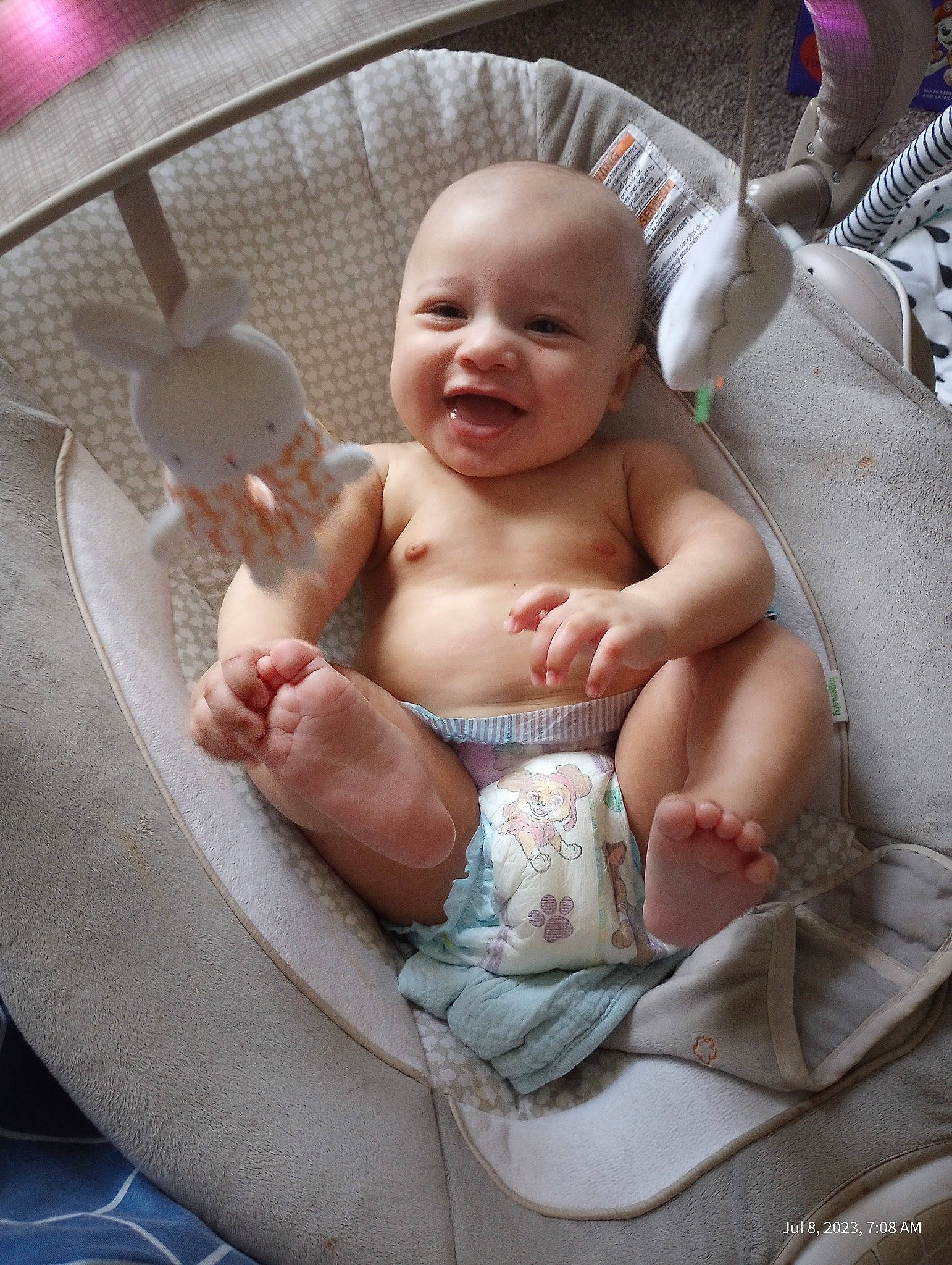 Cain is registered to the contest to win money with this photo: baby, baby_products, barechested, chair, cheek, chest, child, comfort, event, finger, foot, happy, mouth, muscle, person, sitting, skin, smile, thigh, thumb