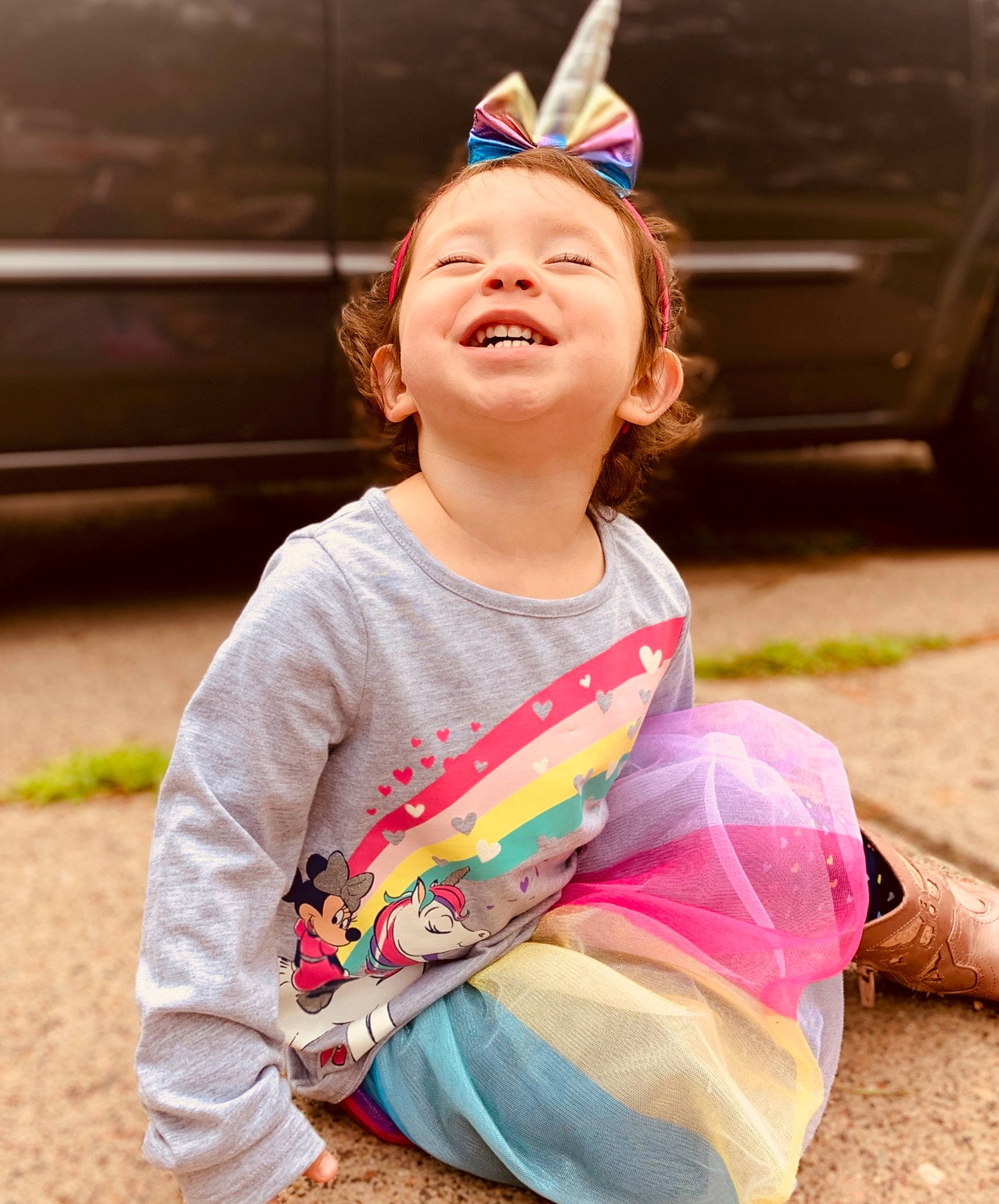 Illiyana is registered to the contest to win money with this photo: child, ear, face, facial_expression, fun, hair, hair_accessory, happy, head, headgear, laugh, people, person, pink, play, sitting, skin, smile, summer, toddler
