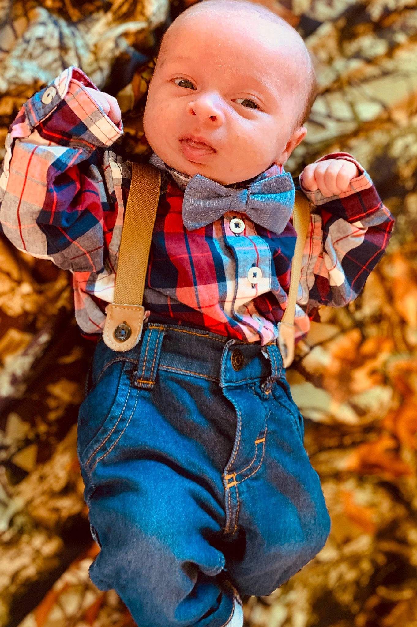 Zayden is registered to the contest to win money with this photo: autumn, baby, cheek, child, leaf, pattern, person, plaid, toddler, toy
