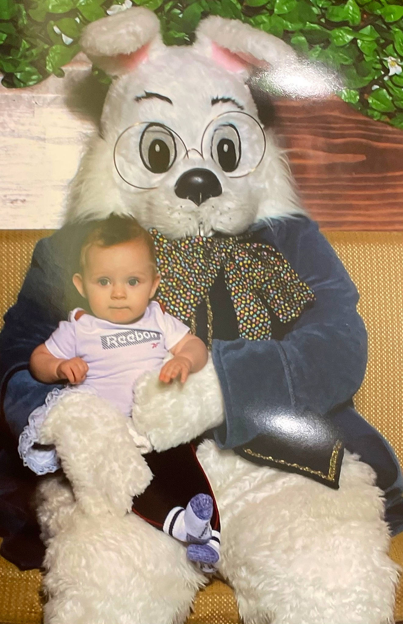 Talon is registered to the contest to win money with this photo: baby, baby_toddler_clothing, child, costume, event, fun, fur, grass, happy, lap, mammal, mascot, person, photograph, pink, plush, sitting, stuffed_toy, textile, toddler