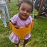 baby, child, curly_hair, event, family, festival, fun, grass, happy, outdoor, park, person, playground, purple_outfit, smile, summer, swing, toddler, tutu_skirt, yellow_swing