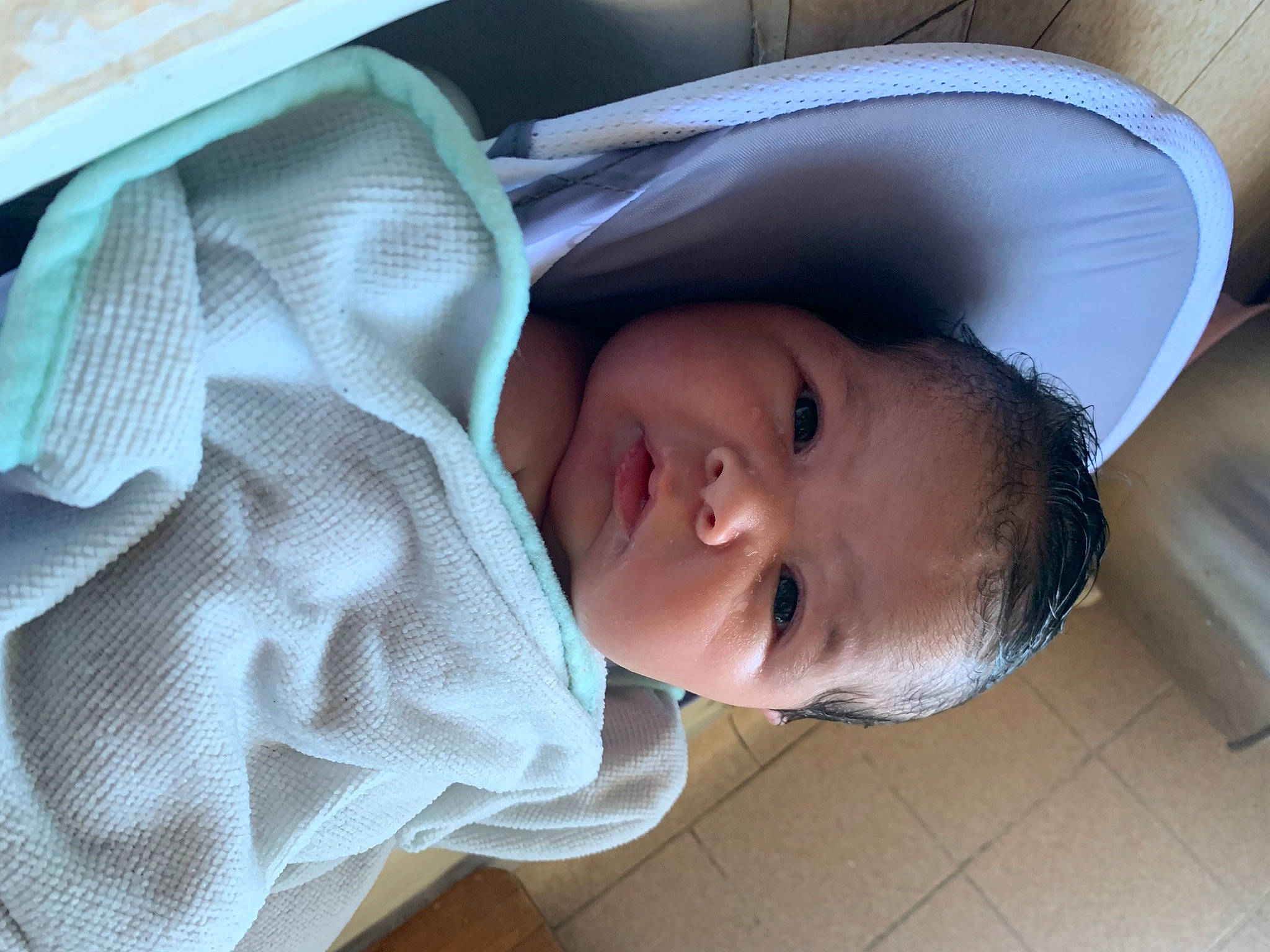 Serenity is registered to the contest to win money with this photo: baby, baby_products, baby_toddler_clothing, cheek, child, comfort, eyebrow, eyelash, fashion_accessory, fun, happy, hat, linens, lip, nose, person, skin, smile, toddler, tree