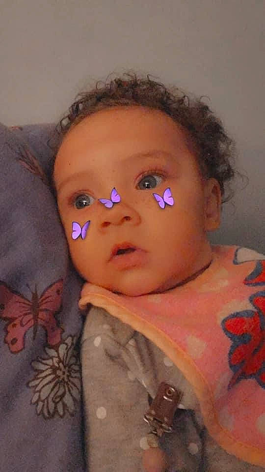 Ja'Layah is registered to the contest to win money with this photo: arthropod, baby, black_hair, butterfly, cheek, chin, eye, eyebrow, eyelash, flash_photography, forehead, insect, iris, lip, mouth, neck, nose, person, pink, pollinator