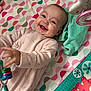 Amelia joined the competition — help win amazing prizes! baby, blanket, child, clothing, colorful, cute, face, hand, happy, indoors, infant, lying_down, pattern, person, play_mat, playtime, smile, soft_toy, toddler, toy