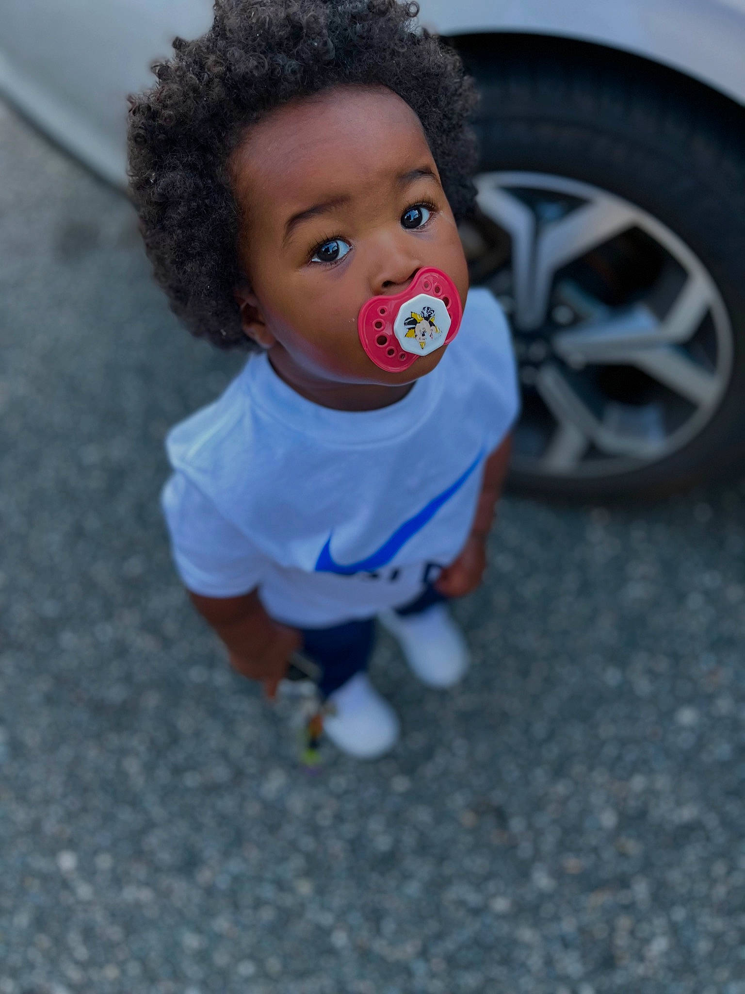 Kacey is registered to the contest to win money with this photo: asphalt, automotive_design, automotive_tire, baby, baby_toddler_clothing, car, child, electric_blue, eye, flooring, fun, happy, mammal, person, rim, t_shirt, tire, toddler, toy, vehicle_door