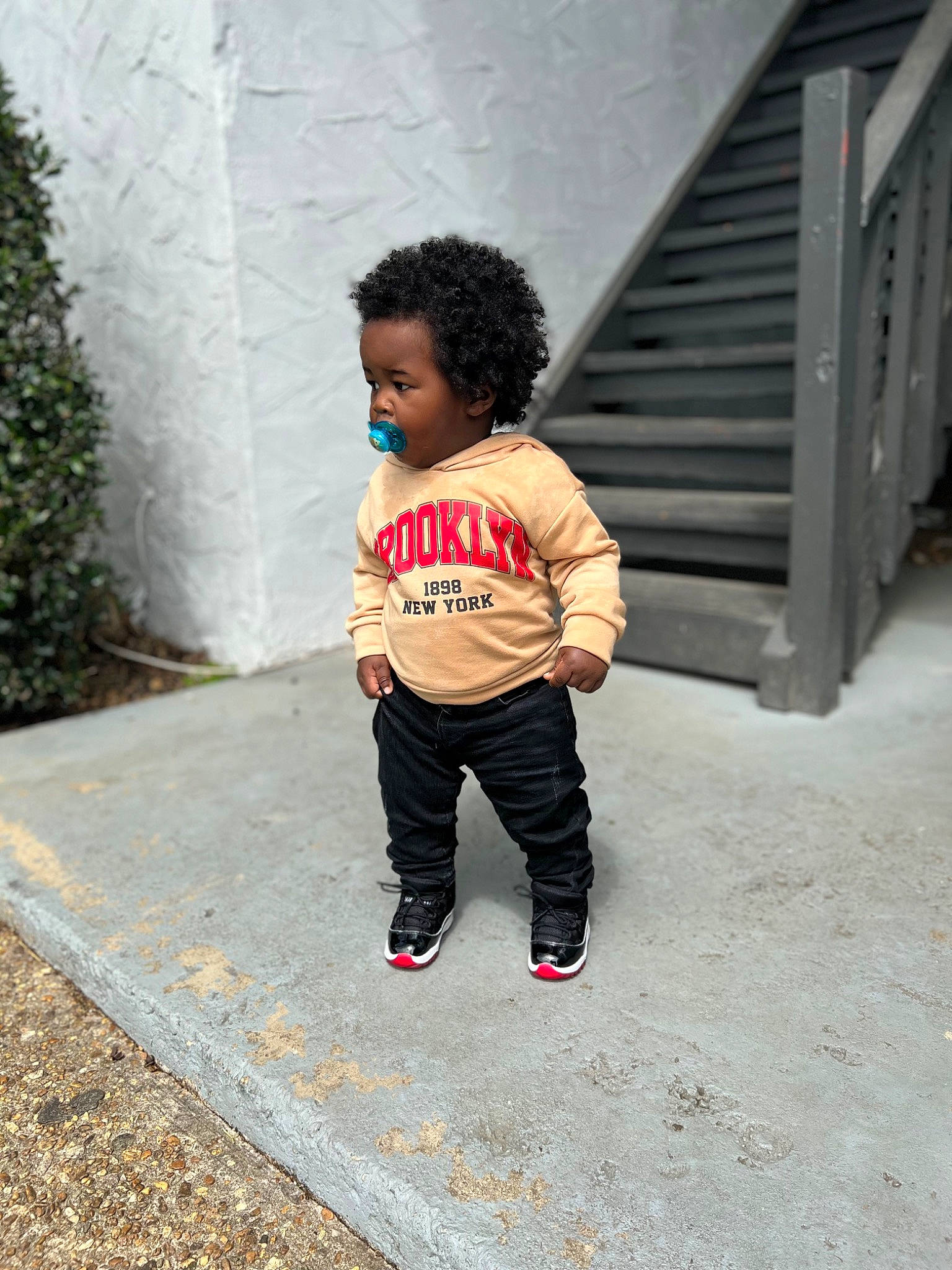 Kacey is registered to the contest to win money with this photo: asphalt, baby_toddler_clothing, child, concrete, denim, grass, grey, person, plant, road, road_surface, shadow, sidewalk, sleeve, soil, street, street_fashion, t_shirt, tints_and_shades, toddler