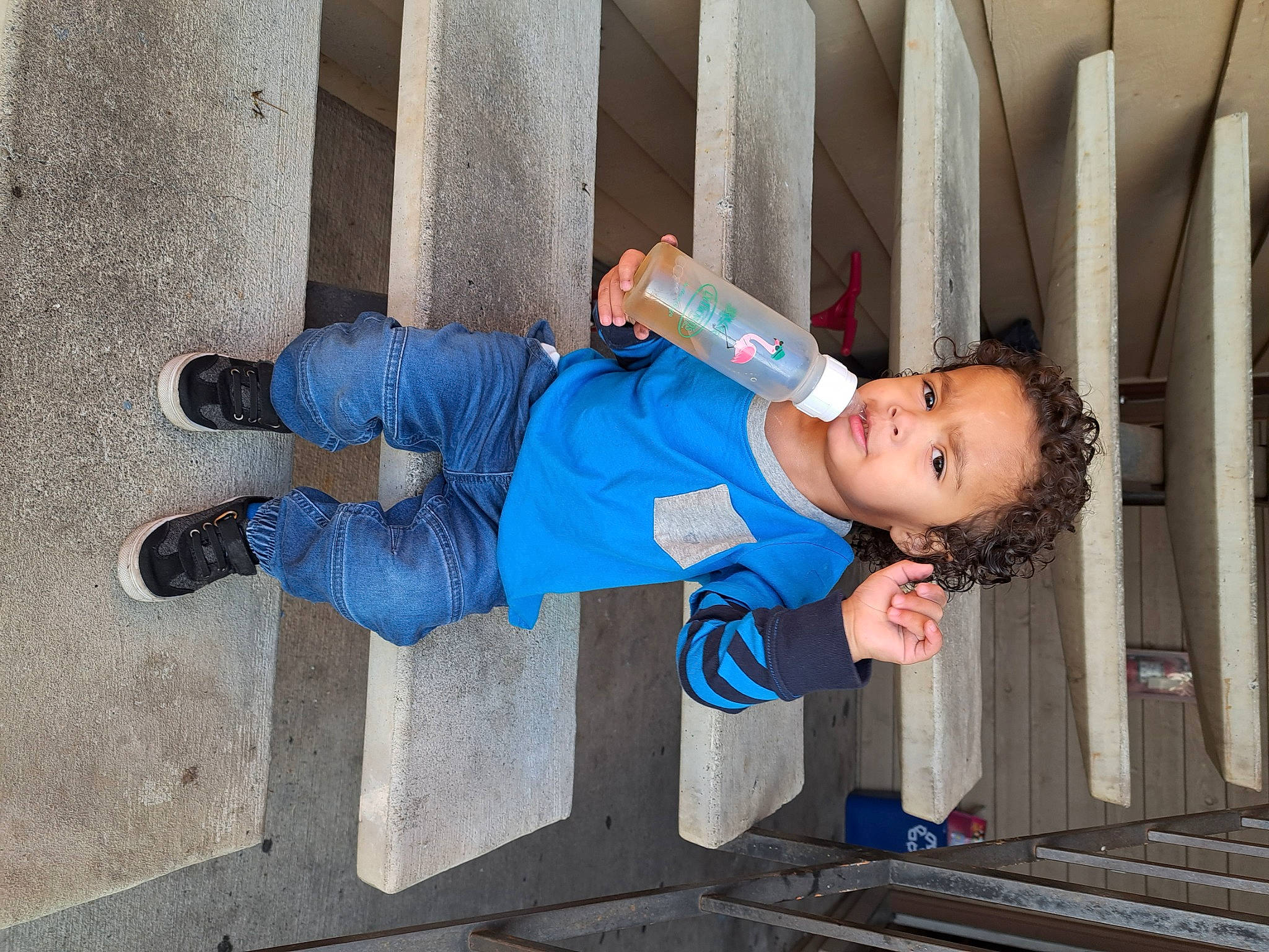 Sir is registered to the contest to win money with this photo: baby_toddler_clothing, child, composite_material, concrete, denim, elbow, electric_blue, human_leg, person, sleeve, toddler, walking_shoe