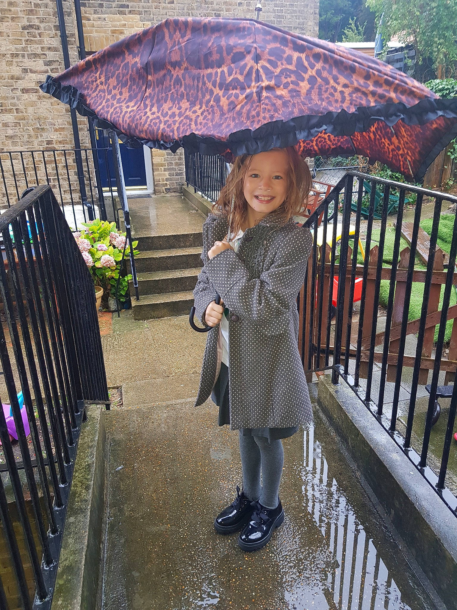 Ellie-mai joined the competition — help win amazing prizes! child, fashion_accessory, joy, person, precipitation, rain, smile, umbrella