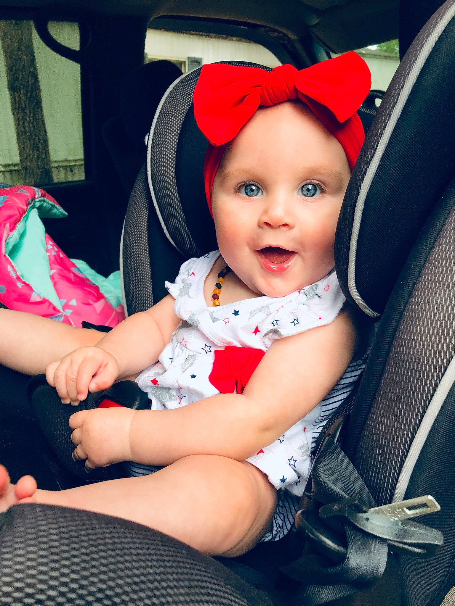 Maleah joined the competition — help win amazing prizes! auto_part, automotive_design, baby, baby_carriage, baby_toddler_clothing, car_seat, car_seat_cover, comfort, fun, happy, human_leg, lap, person, sitting, skin, smile, steering_wheel, surprise, thigh, toddler