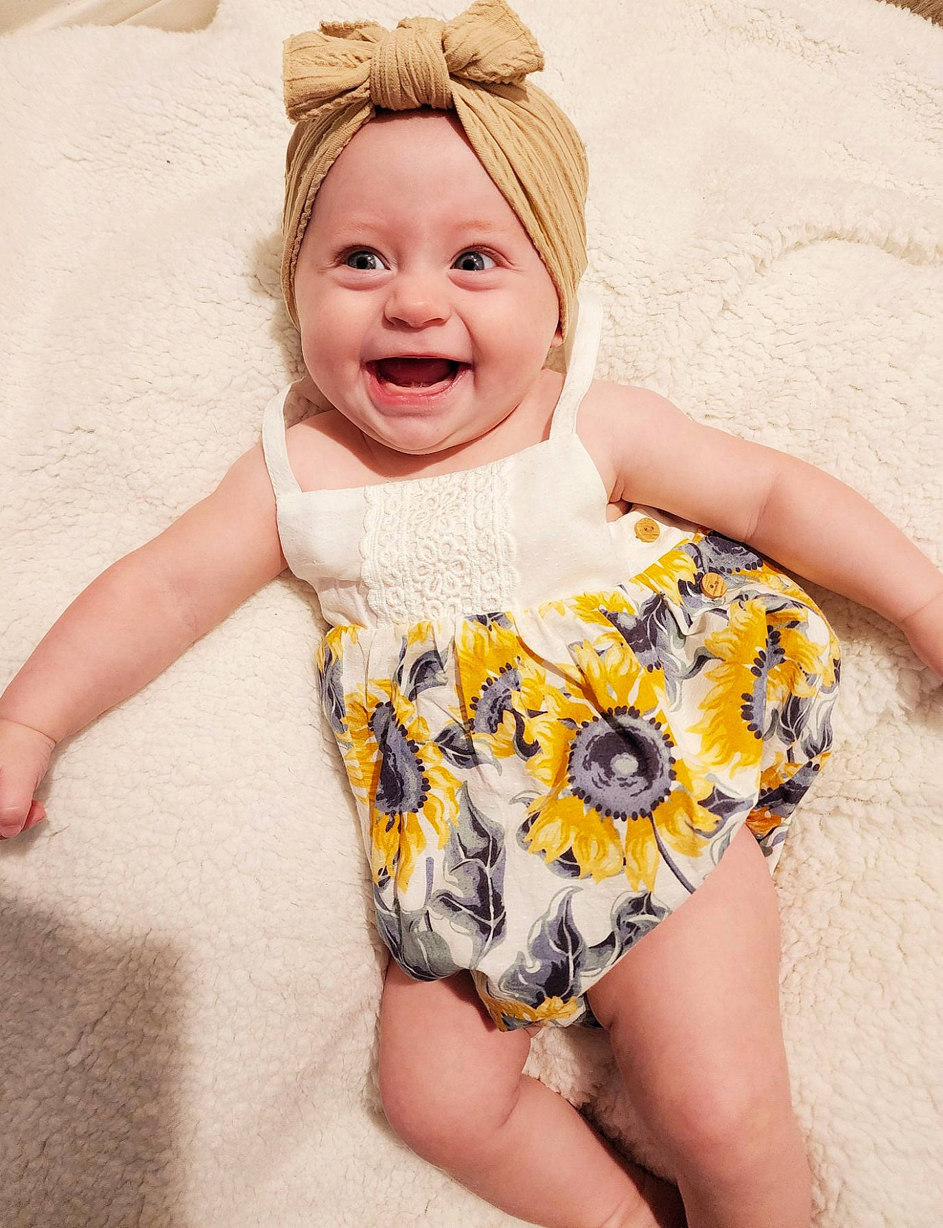 Amiya is registered to the contest to win money with this photo: arm, baby_toddler_clothing, eye, face, facial_expression, finger, hand, happy, head, headwear, joy, neck, organ, person, pink, plant, skin, sleeve, smile, sportswear