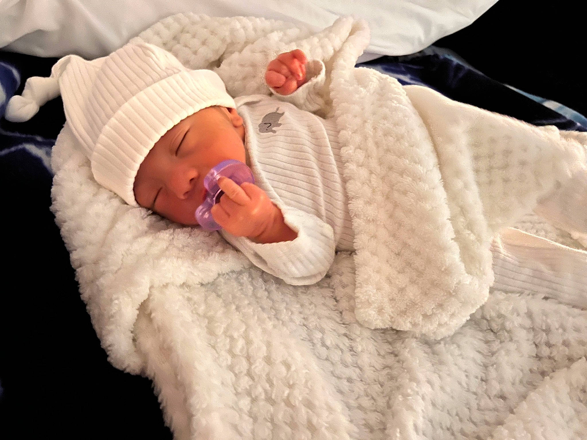 Damian joined the competition — help win amazing prizes! baby, baby_toddler_clothing, child, comfort, fashion_accessory, finger, foot, hand, hat, headgear, headwear, human_body, human_leg, linens, nail, person, skin, sleeve, textile, thumb