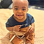 Markel is registered to the contest to win money with this photo: baby, child, toddler, smiling, sitting, blanket, indoors, clothing, sock, cute, happy, portrait, person, face, head, eyes, hands, feet, cozy, warm