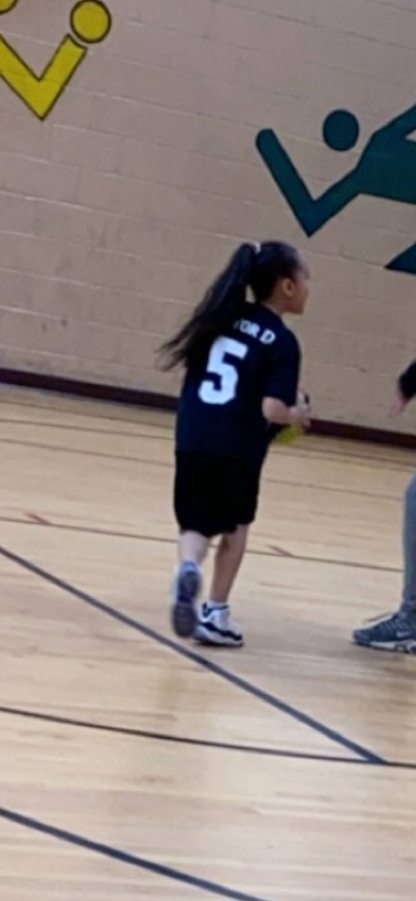 Nevaeh is registered to the contest to win money with this photo: arm, ball_game, competition_event, footwear, fun, hardwood, human_body, joint, knee, leg, person, photograph, play, player, snapshot, sports, sports_equipment, sportswear, standing, team_sport