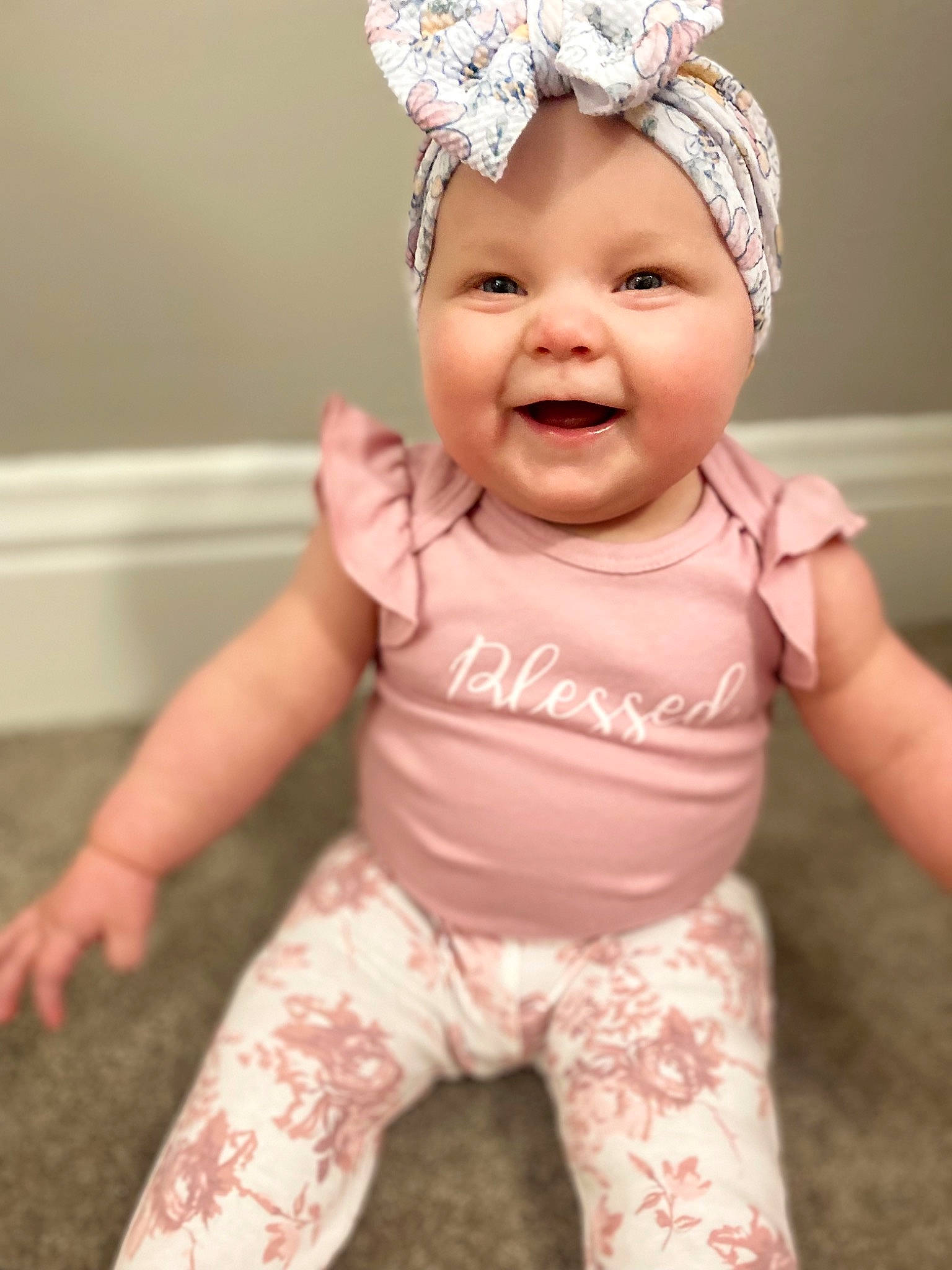 Mykenna is registered to the contest to win money with this photo: baby, baby_toddler_clothing, cap, cheek, eye, face, facial_expression, finger, hand, happy, head, headgear, headwear, joy, lip, person, pink, skin, sleeve, smile