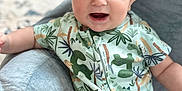 Wyatt joined the competition — help win amazing prizes! baby, child, infant, smile, happy, onesie, clothing, indoor, soft_furniture, face, blue_eyes, cute, plush, cozy, sitting, expression, skin, person, young, comfort