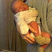 Adonnis joined the competition — help win amazing prizes! baby, newborn, infant, sleeping, person, adult, hand, socks, clothing, onesie, bathroom, mirror, towel, tiles, reflection, skin, holding, gentle, cozy, intimate