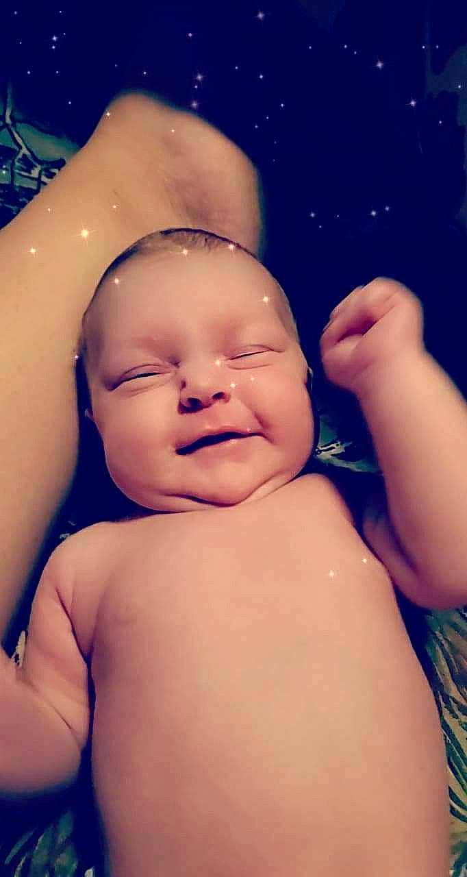 Lucie is registered to the contest to win money with this photo: arm, baby, cheek, child, close_up, face, finger, forehead, hand, head, muscle, neck, person, photography, skin, stomach, toddler