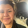 Frankie is registered to the contest to win money with this photo: black_and_white, car, closeup, collar, companion, cute, daylight, dog, face, fluffy, indoor, passenger, pet, portrait, puppy, seat, selfie, smiling, vehicle_interior, woman