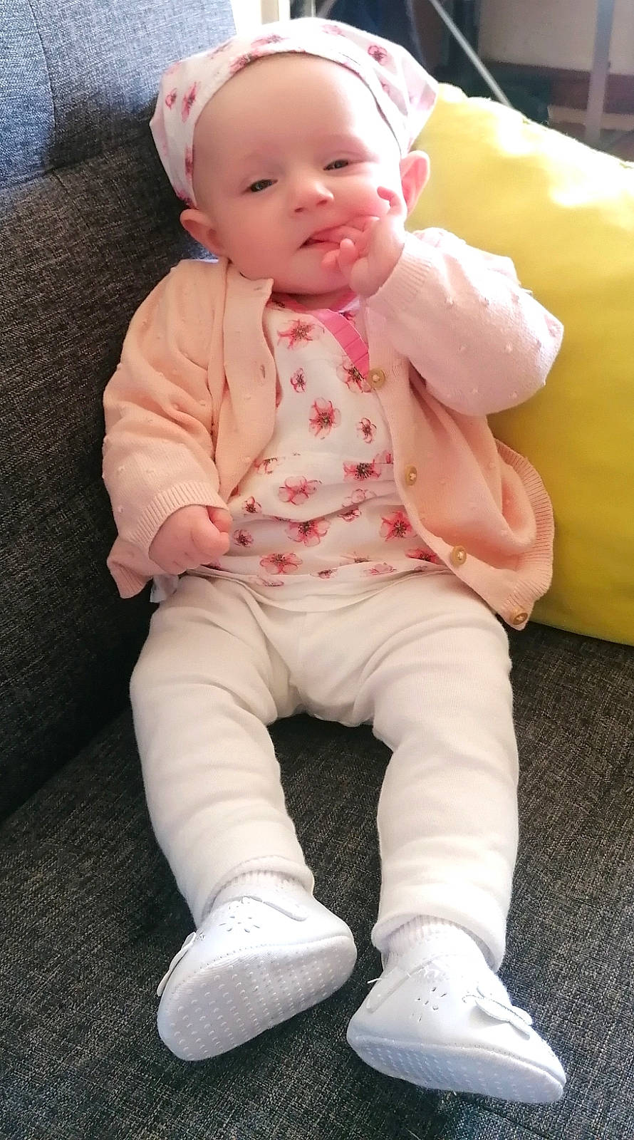 Lilly participe au concours pour gagner de l'argent avec cette photo : baby, baby_toddler_clothing, cheek, child, comfort, face, flooring, happy, human_body, leg, lip, nose, person, pink, shoe, sitting, skin, sleeve, sneakers, toddler