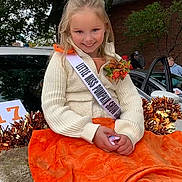 Raylynne is registered to the contest to win money with this photo: adult, advertisement, blanket, child, face, female, furniture, girl, head, lady, male, man, person, photography, plant, portrait, pottedplant, sash, sitting, student