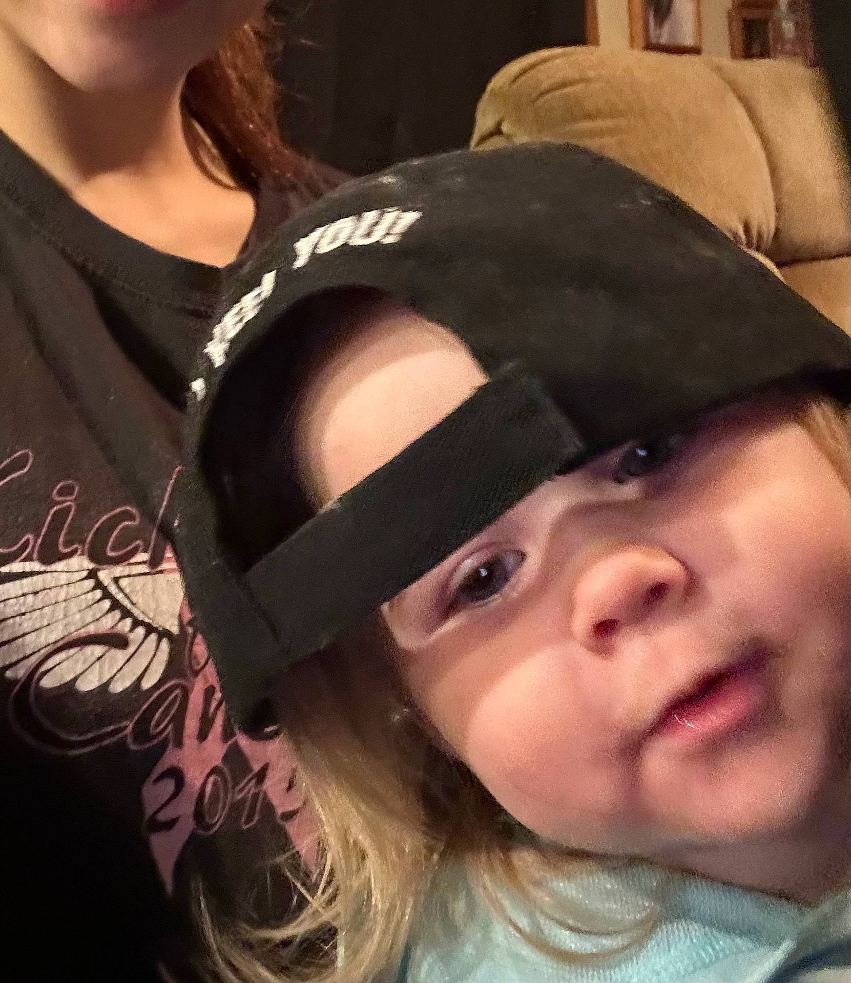 accessories, baby, baseballcap, cap, clothing, coat, couch, face, furniture, glasses, happy, hat, head, jacket, person, photography, portrait, selfie, smile, t_shirt