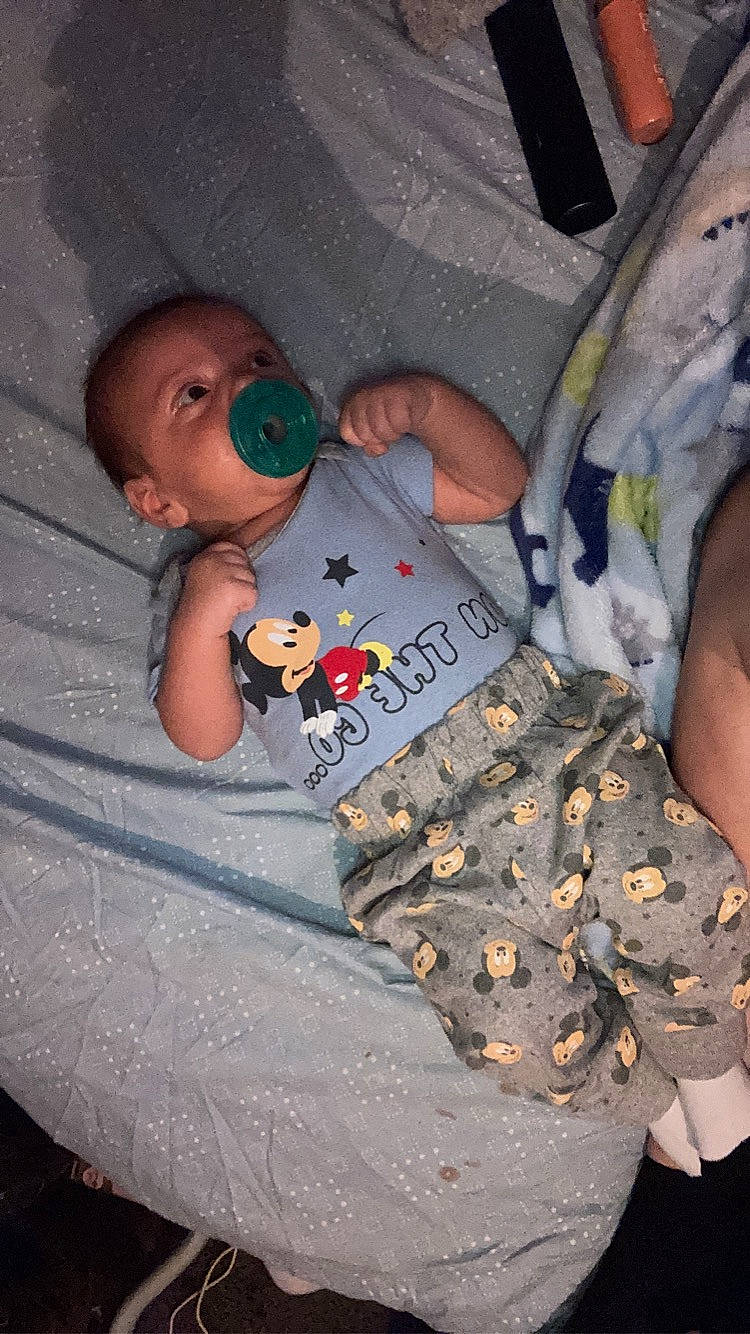 Stetson Thomas is registered to the contest to win money with this photo: baby, baby_products, baby_toddler_clothing, camouflage, child, comfort, fun, gesture, linens, military, military_camouflage, military_person, military_uniform, non_commissioned_officer, pattern, person, room, sitting, t_shirt, toddler