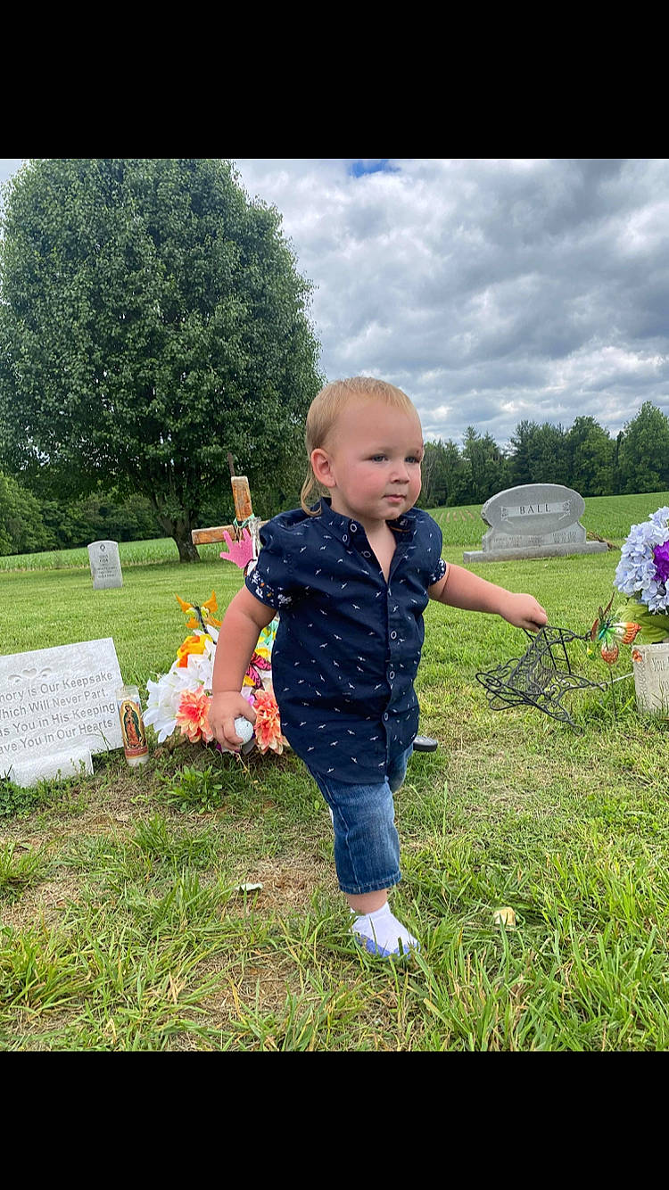 Waylon is registered to the contest to win money with this photo: baby, baby_toddler_clothing, child, cloud, fun, grass, grass_family, grassland, grave, happy, lawn, leisure, meadow, people_in_nature, person, plant, recreation, sitting, sky, toddler