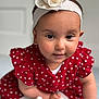 baby, child, girl, headband, flower, red_dress, polka_dot, crawling, indoor, portrait, cute, smiling, skin, face, eyes, hand, white_socks, soft_light, closeup, infant