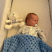 Frankie joined the competition — help win amazing prizes! baby, newborn, sleeping, pacifier, blanket, crochet, crib, plush_toy, bear, hoodie, clothing, soft_toy, infant, bed, sleep, comfort, cute, indoor, rest, child