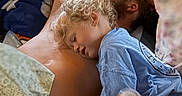 Merrick joined the competition — help win amazing prizes! adult, bed, blanket, casual, child, cozy, curly_hair, curtains, family, home, indoor, notification, person, phone_screen, rest, shirtless, sleeping, snuggling, tender_moment, time