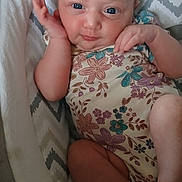 Lydiarose joined the competition — help win amazing prizes! baby, infant, child, onesie, floral_pattern, cushion, seat, hand, face, skin, foot, leg, blue_eyes, expression, comfort, indoors, cute, newborn, lying_down, soft