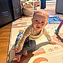 Hélio a rejoint le concours — aidez-le/la à gagner de superbes lots ! baby, child, crawling, smiling, play_mat, indoor, home, floor, window, cabinet, basket, curtains, toy, person, clothing, feet, head, face, light, room