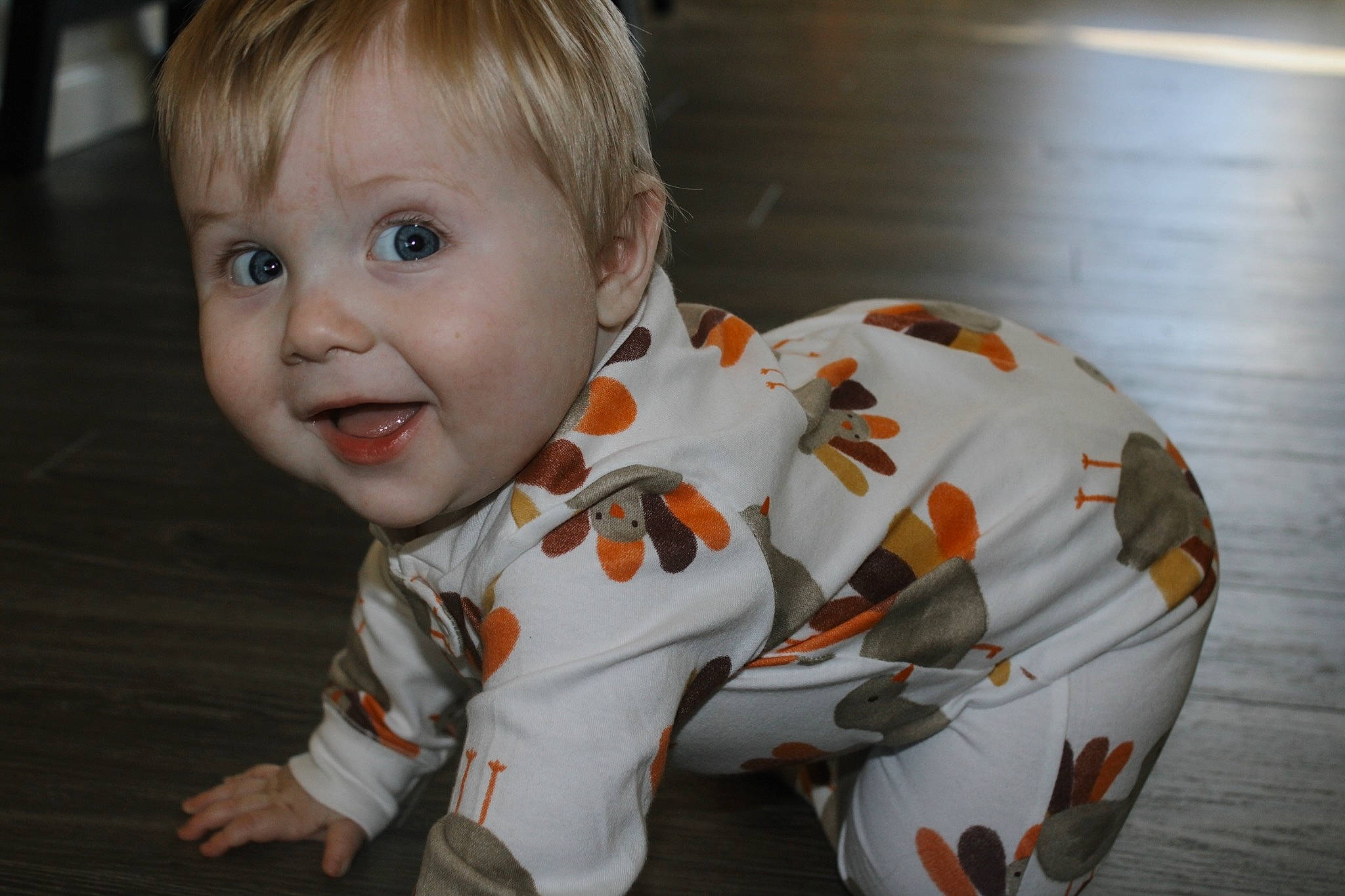 Jase joined the competition — help win amazing prizes! baby, baby_toddler_clothing, carmine, cheek, child, face, floor, flooring, fun, happy, hardwood, nose, orange, person, sitting, skin, sleeve, smile, t_shirt, toddler