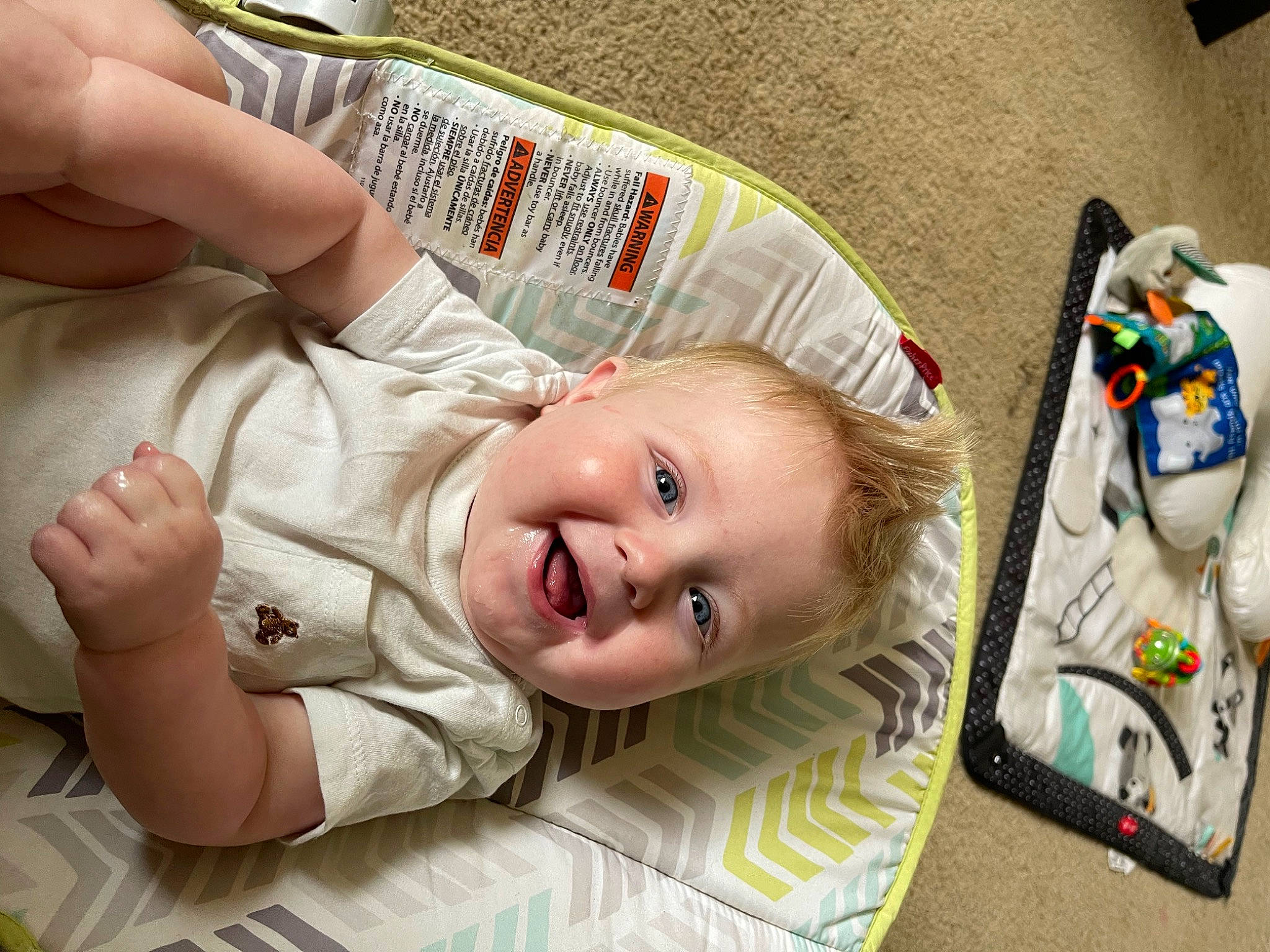 Jase is registered to the contest to win money with this photo: baby, baby_laughing, baby_products, baby_toddler_clothing, cheek, child, comfort, flooring, fun, grass, happy, person, sitting, skin, sleeve, smile, textile, thumb, toddler, toy
