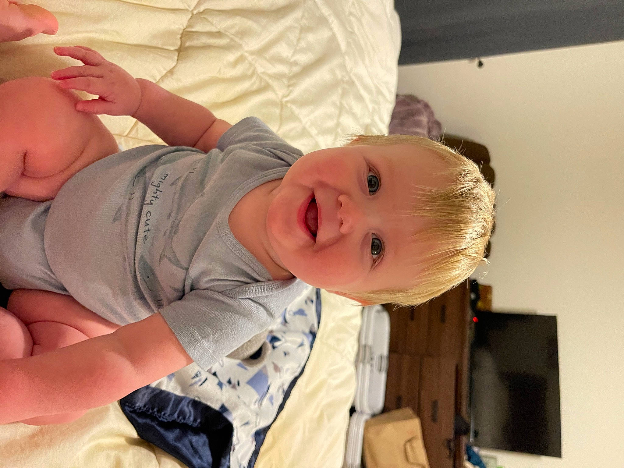 Jase is registered to the contest to win money with this photo: abdomen, arm, baby, baby_toddler_clothing, cheek, chest, comfort, elbow, eye, finger, gesture, happy, human_body, joy, mouth, person, skin, sleeve, smile, stomach