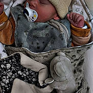 Kalvynn participe au concours pour gagner de l'argent avec cette photo : baby, sleeping, blanket, pacifier, hat, plush_toy, soft_toy, cozy, infant, child, cute, warm, fabric, bedtime, comfort, cuddle, rest, wrapped, cute_outfit, indoors