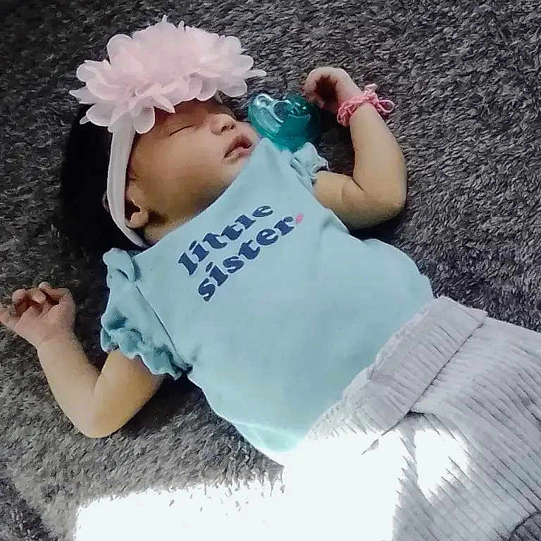 Autumn joined the competition — help win amazing prizes! baby, child, infant, lying_down, carpet, flower_headband, blue_shirt, little_sister, bottle, drinking, sunlight, indoor, portrait, casual, fashion, bracelet, gray_pants, smiling, family, cute