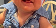 Raelynn joined the competition — help win amazing prizes! baby, infant, denim_shirt, smile, crawling, face, cheeks, blanket, indoor, child, happy, young, cute, person, home, furniture, arm, head, bright_eyes, closeup