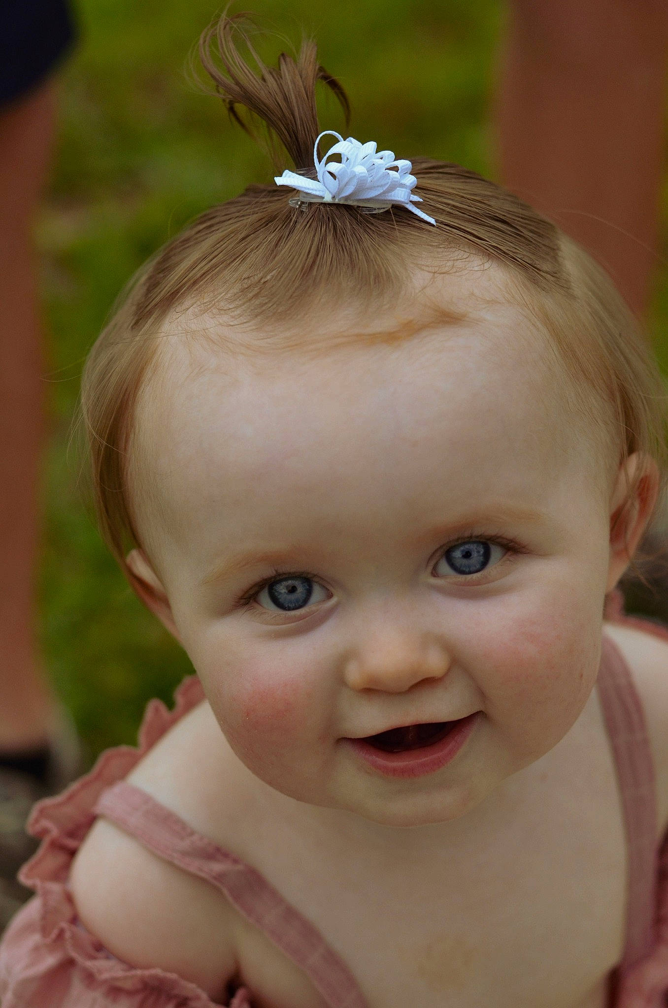 Adalynn is registered to the contest to win money with this photo: arm, baby, cheek, chin, dress, eye, eyebrow, eyelash, face, hand, happy, head, human_body, insect, iris, joy, lip, nose, person, plant