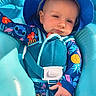 baby, child, infant, blue_hat, swimsuit, floaty, pool, water, sun_hat, relaxed, toddler, outdoor, summer, cute, sitting, colorful_clothing, sunlight, face, hand, seat