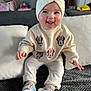 Lylia participe au concours pour gagner de l'argent avec cette photo : baby, child, clothing, couch, cute, footwear, happy, home_interior, indoor, infant, knitted_headband, minnie_mouse, person, pillow, portrait, shoes, sitting, smiling, sweater, toy